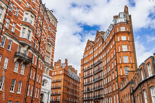 Canvas Print Iconic Red Brick Buildings in London with Classic Architecture