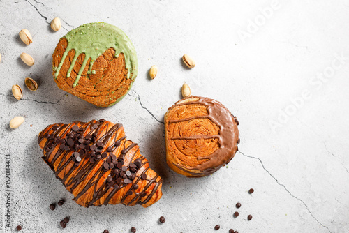 Various new york roll croissants and traditional french croissant with chocolate fillling.