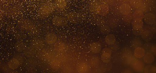 Dark brown panorama background with golden sparkling lights, holiday wallpaper, copy space