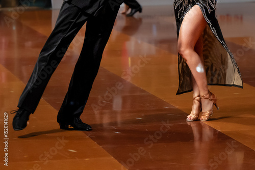 Wallpaper Mural a couple dance a Latin dance. the legs of a dancing couple Torontodigital.ca