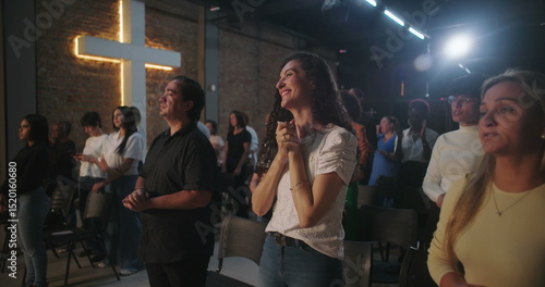 Canvas Print Congregation members with joyful expressions, standing during a Christian church