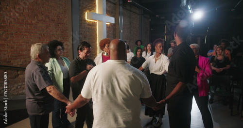 Fototapete Group of people holding hands in prayer during church service, pastor leading sp