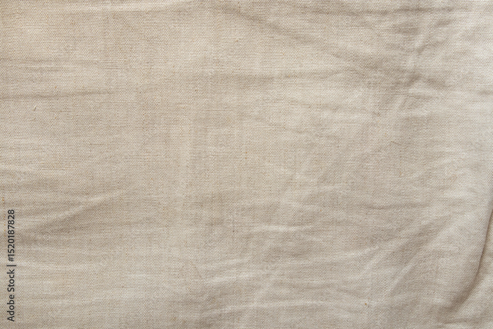 Fototapeta premium Natural beige linen fabric texture close-up, background for design