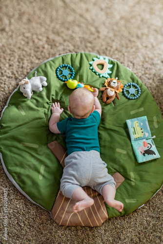 Photography Baby doing tummy time with toys