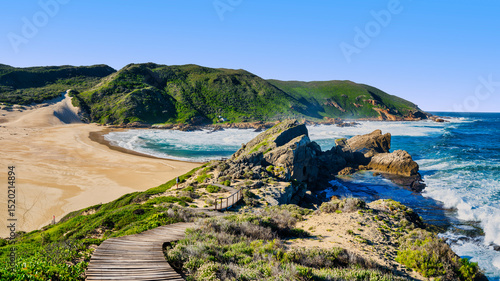 Southern tip of Robberg Peninsula: rugged cliffs, lush fynbos, and walkway, Plettenberg Bay, South Africa