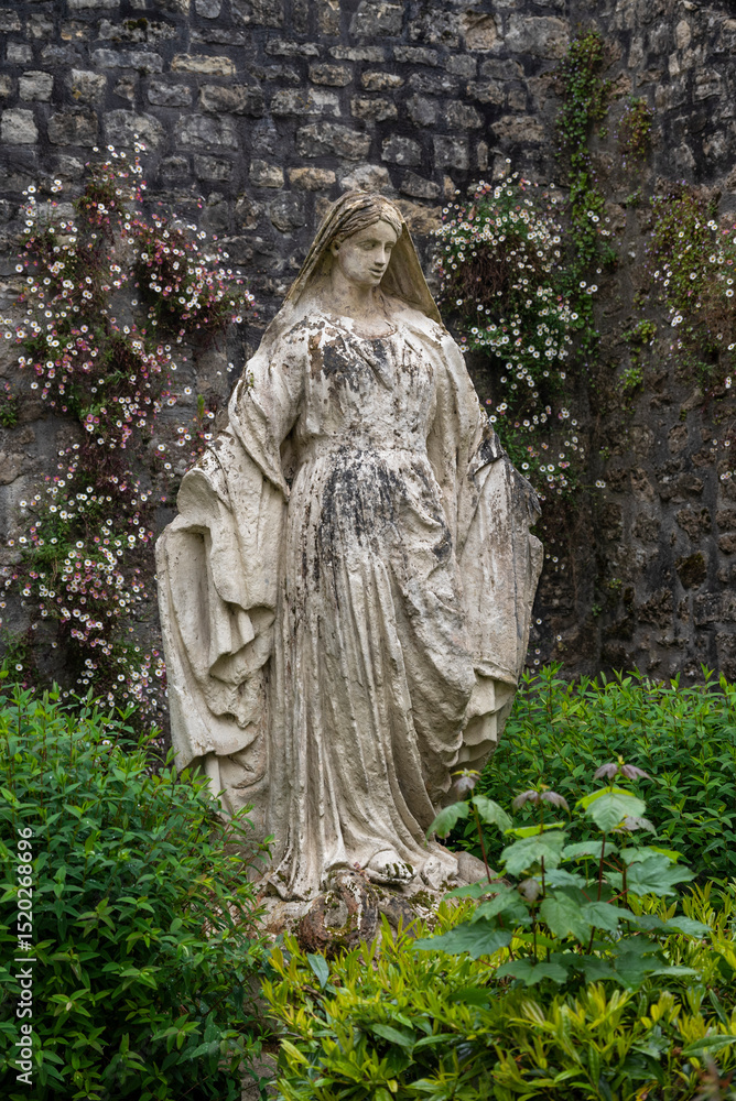 Fototapeta premium Female statue in a garden, Bayeux, Normandy, France