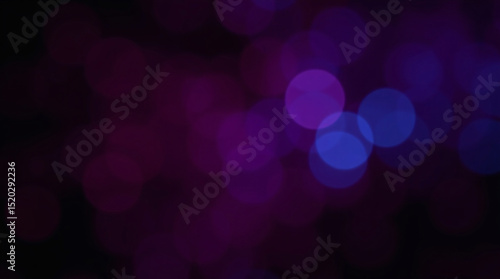 Abstract bokeh lights in purple and blue hues.
