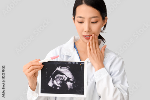 Female doctor holding ultra...