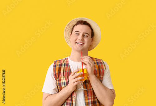 Young man in hat with cockt...