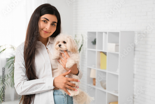 Young woman holding her whi...