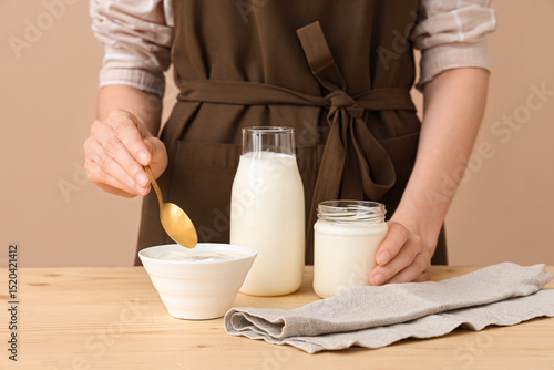 Woman with bowl and jar of ...