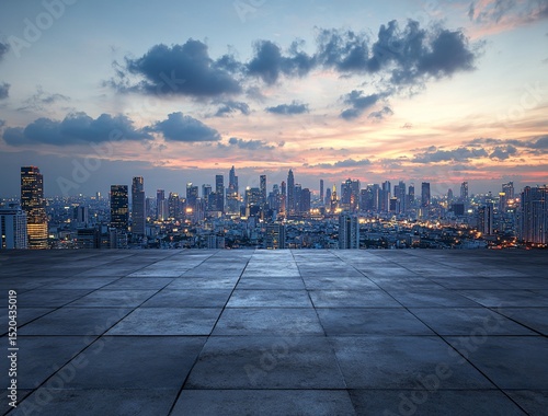 Panoramic cityscape view at sunset, from an empty rooftop plaza.
