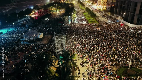 Wallpaper Mural Open air music concert festival. Massive crowd gathering for night event near coastline. Colorful stage lighting illuminating energetic music performance with dynamic visual effects Torontodigital.ca