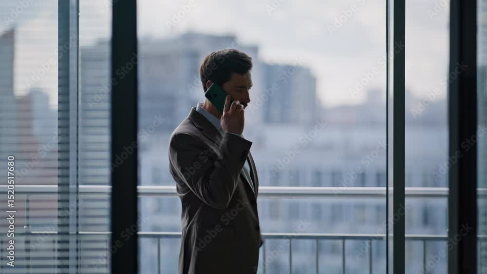 Worried ceo calling phone strolling near office window closeup. Nervous manager Worried ceo calling phone strolling near office window closeup. Nervous manager