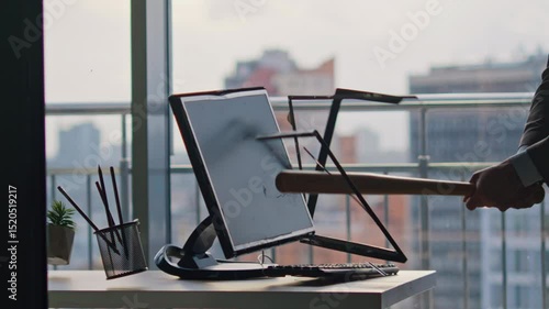Unknown businessman smashing computer screen using bat inside office closeup