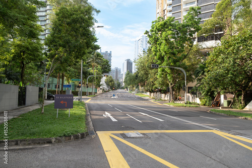 Wallpaper Mural Orchard Road street view with lush greenery and urban skyline backdrop Torontodigital.ca