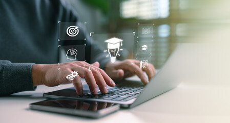 Online education and digital learning concept. Hands typing on a laptop with education icons such as diploma, brain, and target, ideal for e-learning platforms, digital skill development.