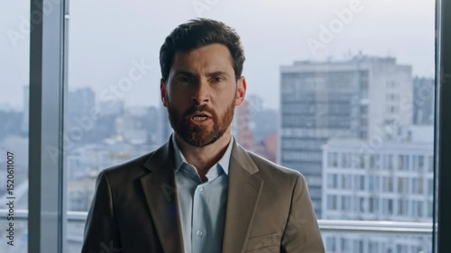 Portrait angry boss gesturing hands at panoramic office. Man screaming loudly 