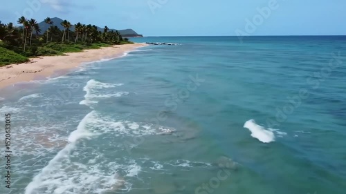 Waves striking beach aerial view. Summer beach travel concept.