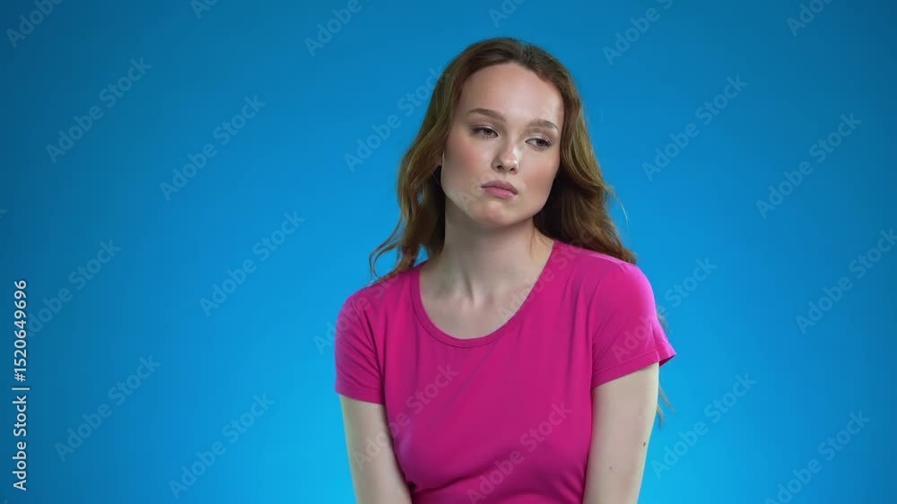 Woman expressing deep emotion in a beauty studio setting with vibrant colors Woman expressing deep emotion in a beauty studio setting with vibrant colors