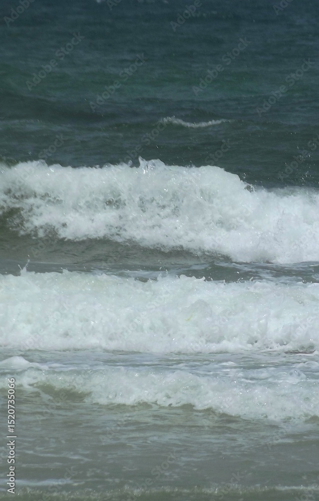 Fototapeta premium Foamy waves on sea surface.