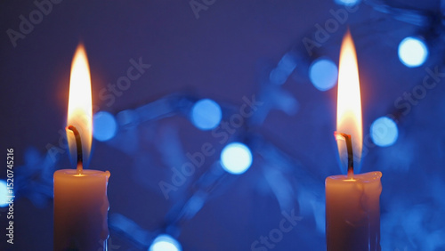 wax candles burning with celebration blur blue background.ai 
