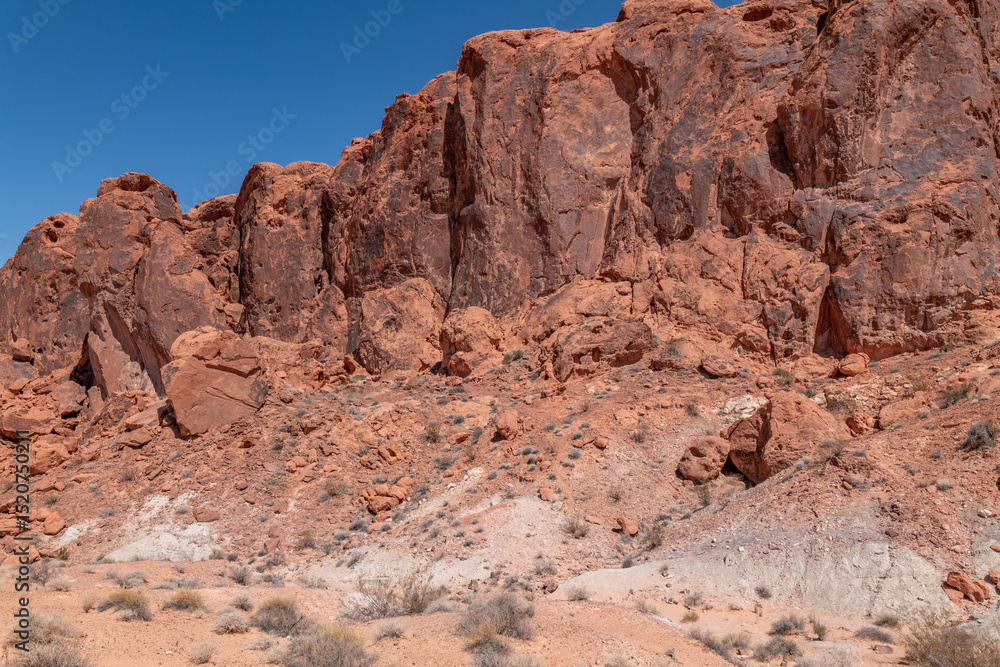 Desert varnish, red Aztec Sandstone outcrops with Willow Tank Formation. Fire Wave Trail, Valley of Fire State Park, Clark County, Nevada geology. Desert varnish, red Aztec Sandstone outcrops with Willow Tank Formation. Fire Wave Trail, Valley of Fire State Park, Clark County, Nevada geology.