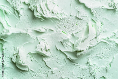 Close-up view of textured mint green ice cream.