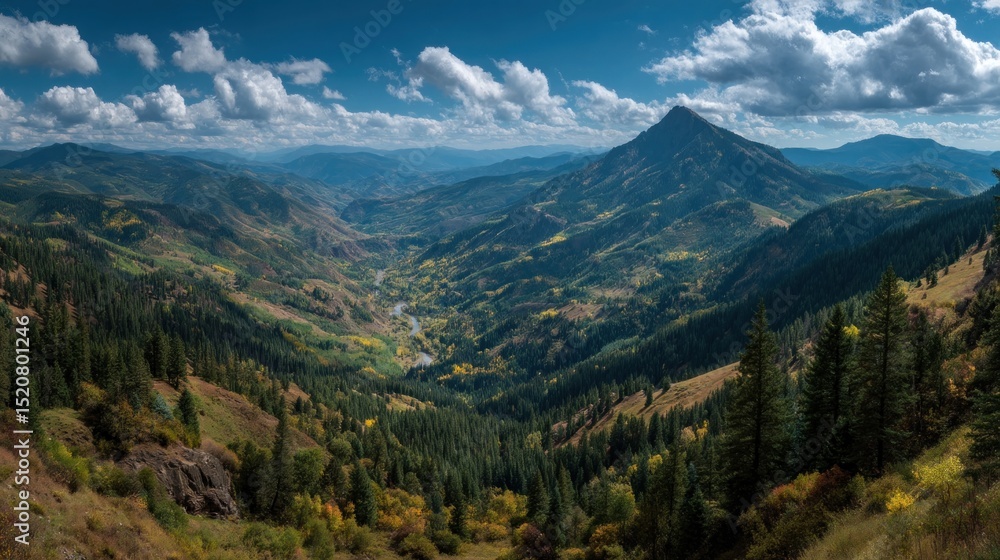 Fototapeta premium Expansive mountain vista with lush valleys and dynamic cloudscape above