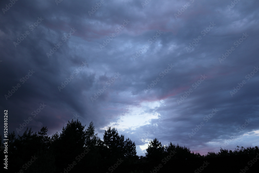 Fototapeta premium Beautiful colorful stormy sky at sunset. Sunset with mood stormy sky