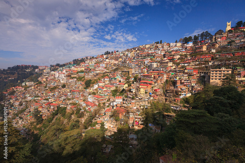 Canvas Print Panoramic view of Shimla, a hillside city in Himachal Pradesh, India, with colorful houses built on the slopes