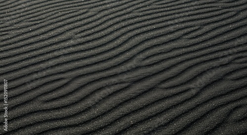 Black sand texture with wind patterns