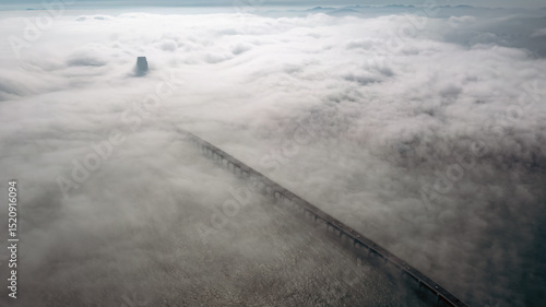 Obraz na plátně The city in the clouds, the advection fog on the sea