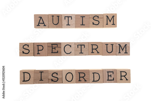 Autism Spectrum Disorder spelt with wooden blocks on a white background