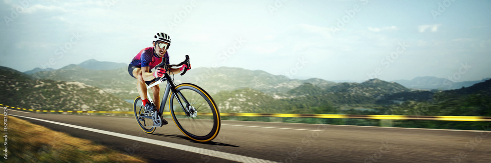 Fototapeta premium Banner. Hand made collage. Cyclist in aerodynamic position racing on open mountain road, blurred background enhances motion and speed. Concept of professional sport, cycling race, competition