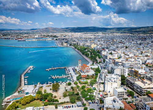 Fototapeta Naklejka Na Ścianę i Meble -  Panoramic aerial view of the cityscape of Volos, Magnesia, Greece, with Agios Konstantinos church and yacht marina