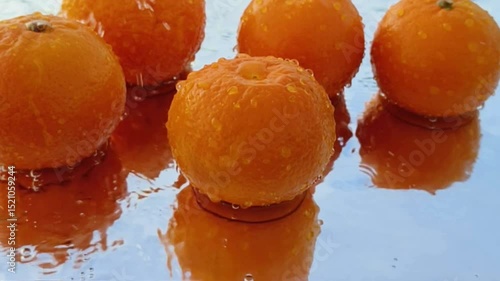 Orange with splash, drip and whirlpool. Makes a refreshing impression. Horizontal Video.