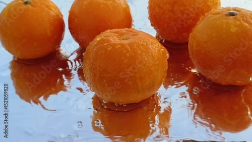 Orange with splash, drip and whirlpool. Makes a refreshing impression. Horizontal Video.