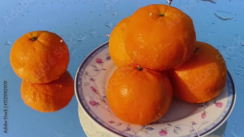 Orange with splash, drip and whirlpool. Makes a refreshing impression. Horizontal Video.