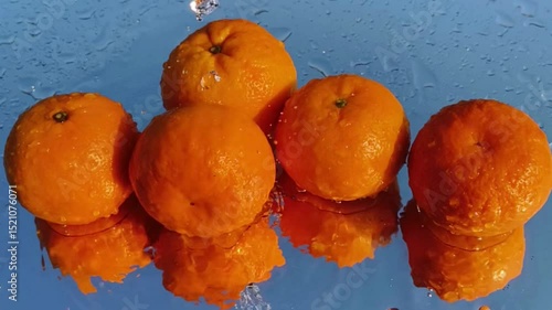 Orange with splash, drip and whirlpool. Makes a refreshing impression. Horizontal Video.