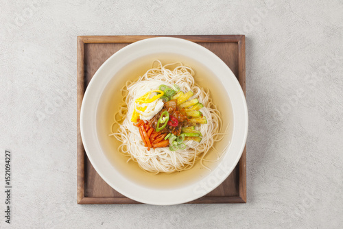  Janchi Guksu refers to noodles that are mainly eaten on feast days. It is a dish made with noodles in a hot clear soup and various toppings.