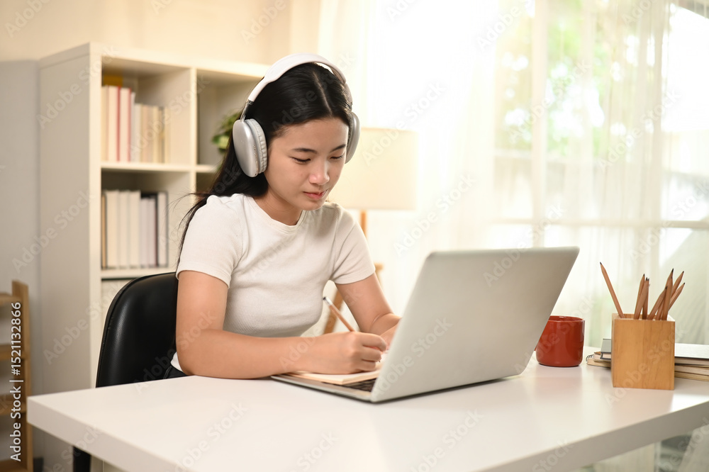 A Focused High School Student Studying Online from Home A Focused High School Student Studying Online from Home