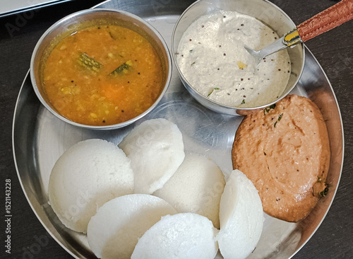 Homemade Idli sambhar and chutney served in plate