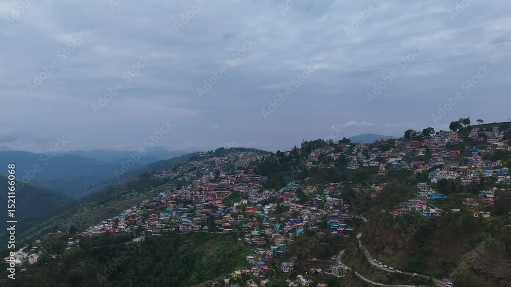 Aerial drone shot capturing the scenic town of Almora, nestled in the Kumaon hills with layered mountain views. Aerial drone shot capturing the scenic town of Almora, nestled in the Kumaon hills with layered mountain views.