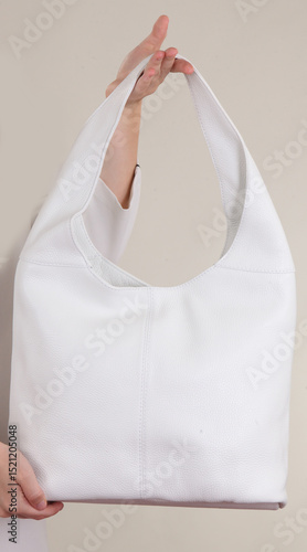 young woman holding a bag