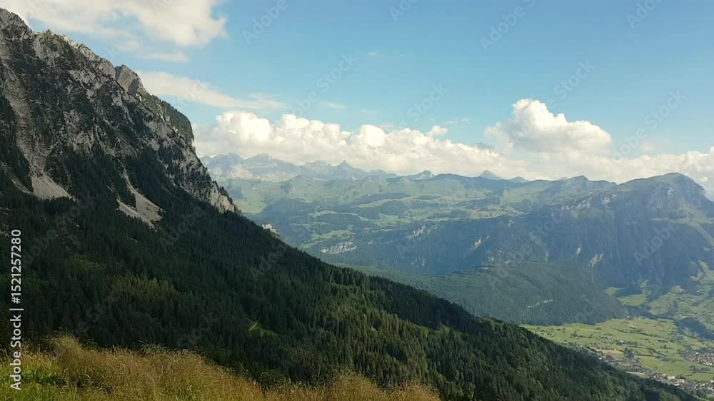 Pan shot of Lake Lucerne and the Mythen mountain range in Switzerland, sunset, Swiss Way of St. James Pan shot of Lake Lucerne and the Mythen mountain range in Switzerland, sunset, Swiss Way of St. James