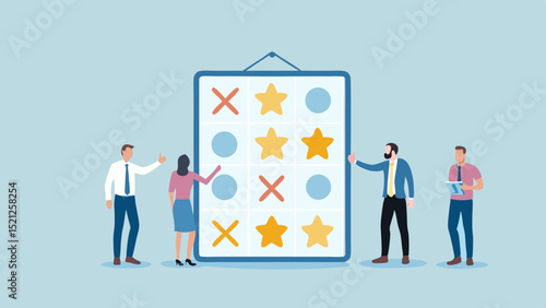 People standing around a board with tic tac toe symbols of crosses circles and stars displayed on it