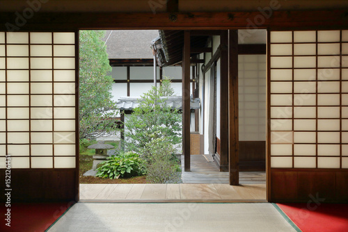Obraz na plátně Interior of a traditional japanese house with sliding doors and view on a japane