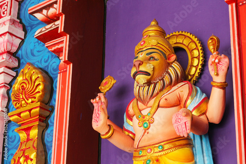 Photography Narasimha avatar of Vishnu - intricate Hindu bas-relief carving on temple wall in Kuala Lumpur, Malaysia