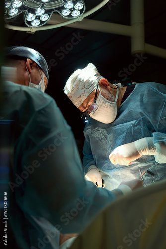 Photos The surgeon is working hard in the operating room